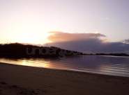 understocks-beach-sunset-lake-romantic-photo-stock-royalty-free