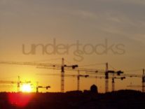 understocks-sun-cranes-city-sunset-photo-stocks