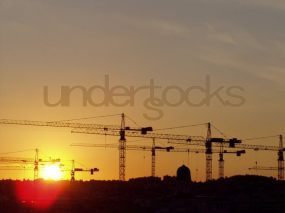 understocks-sun-cranes-city-sunset-photo-stocks